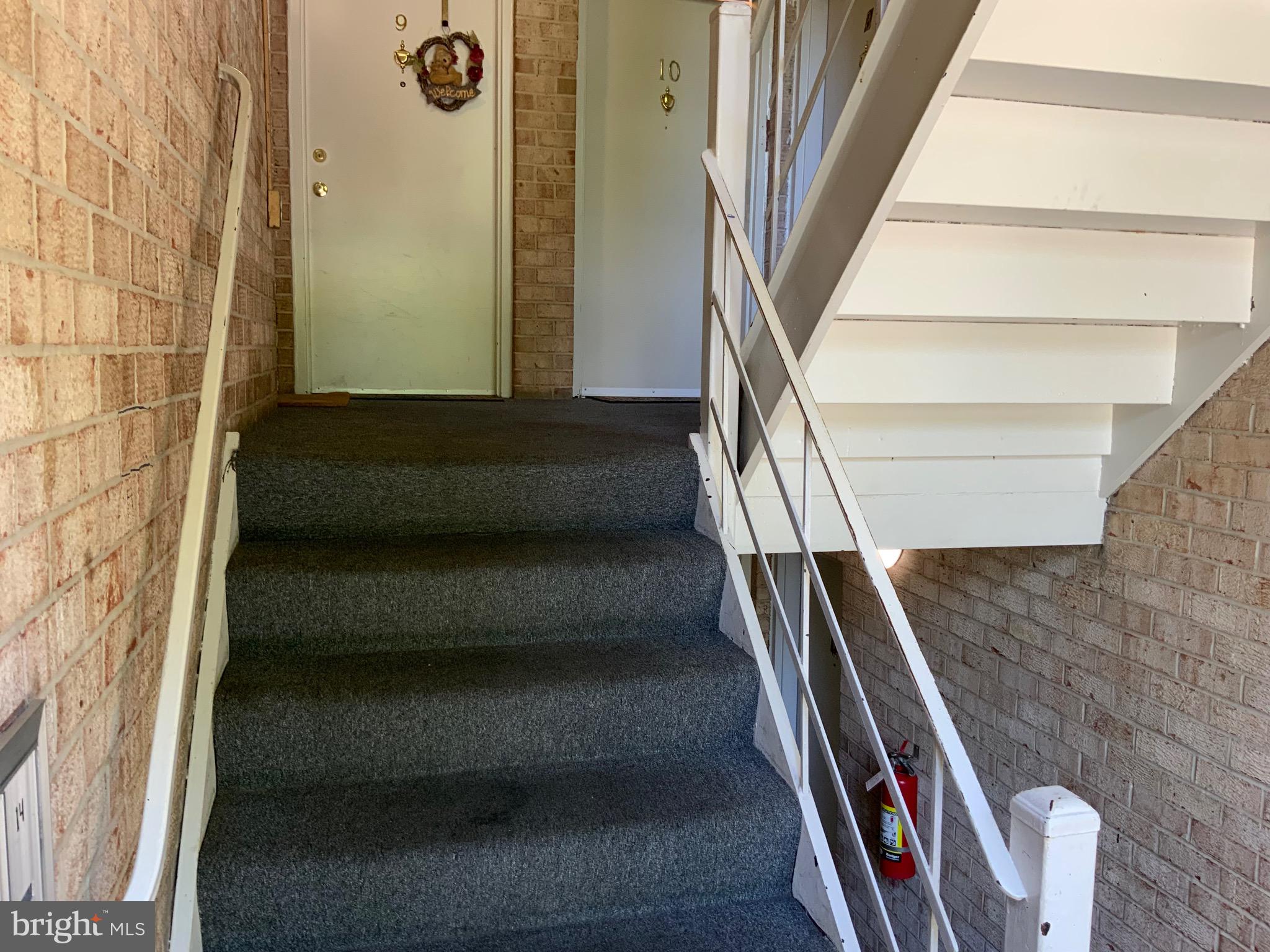 3744 Bel Pre Road, Unit 10 Silver Spring, MD 20906 - Photo 3 of 23 a view of staircase with white walls and railing