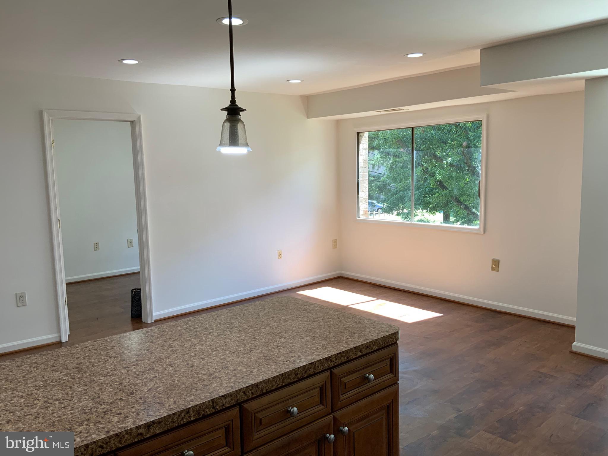 3744 Bel Pre Road, Unit 10 Silver Spring, MD 20906 - Photo 9 of 23 a view of a kitchen with a sink and window