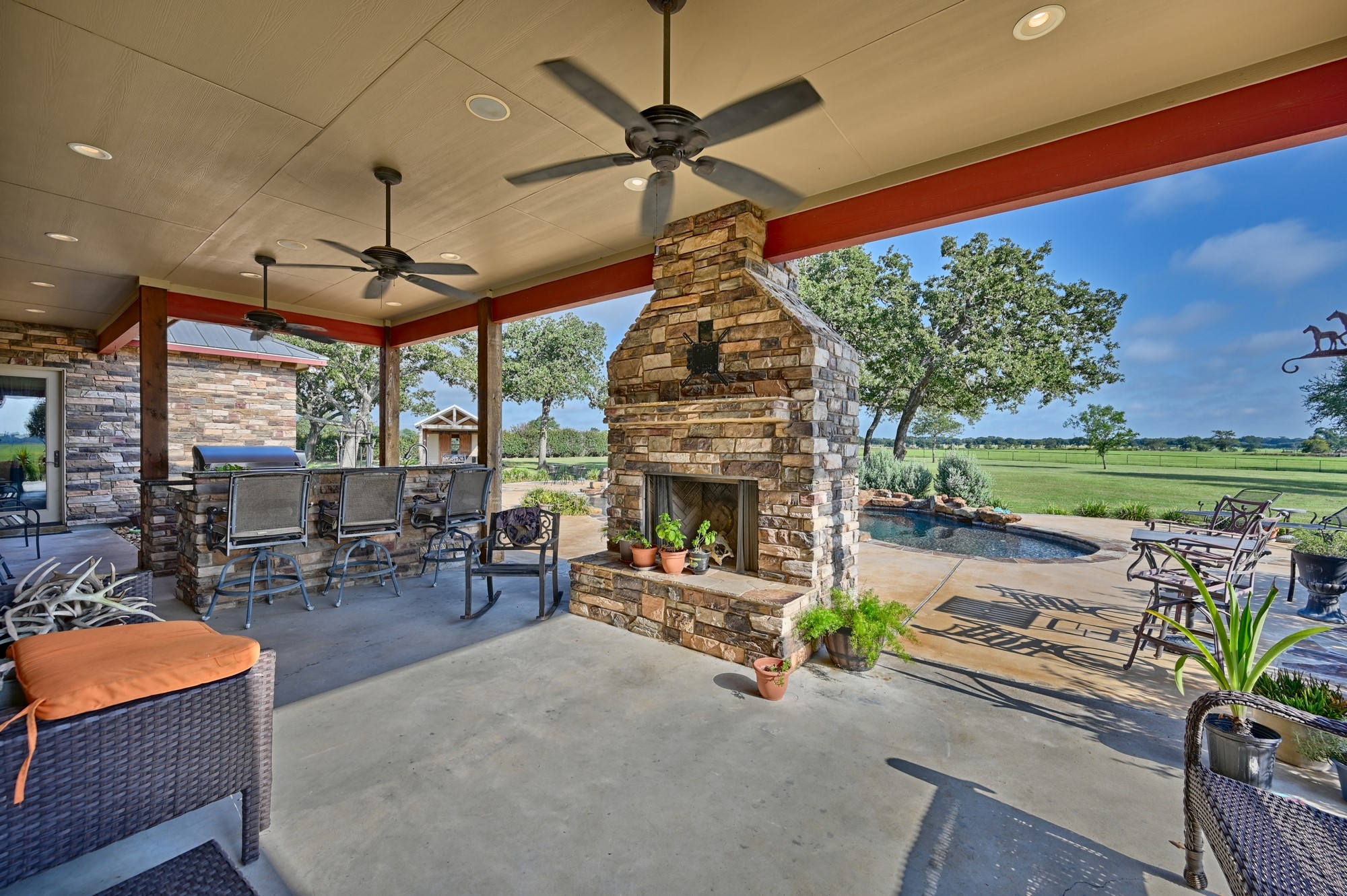 41968 Kelley Road Hempstead, TX 77445 - Photo 31 of 50 Back porch, fireplace, outdoor kitchen, pool and pool house