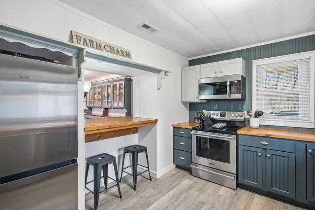 a view of a livingroom with furniture and wooden floor