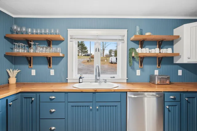a view of a hallway with white walls