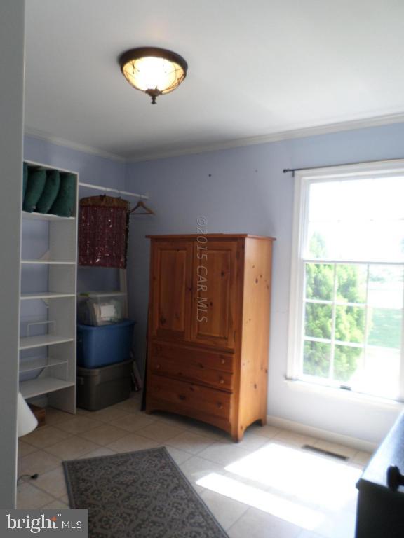 9018 Bethel Road Willards, MD 21874 - Photo 20 of 42 a view of an empty room with a window and cabinet