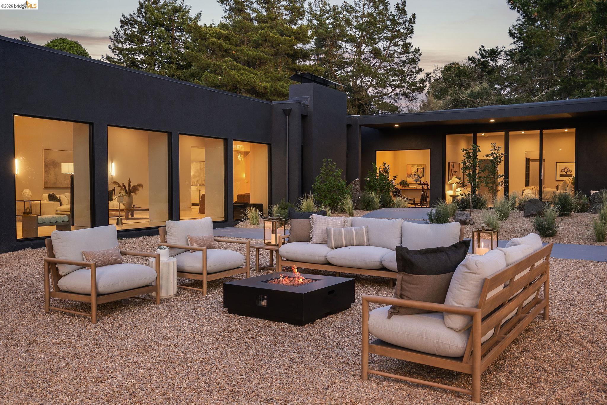 5645 Bacon Road Oakland, CA 94619 - Photo 91 of 94 Spacious exterior courtyard featuring a gravel ground cover and a built-in fire pit