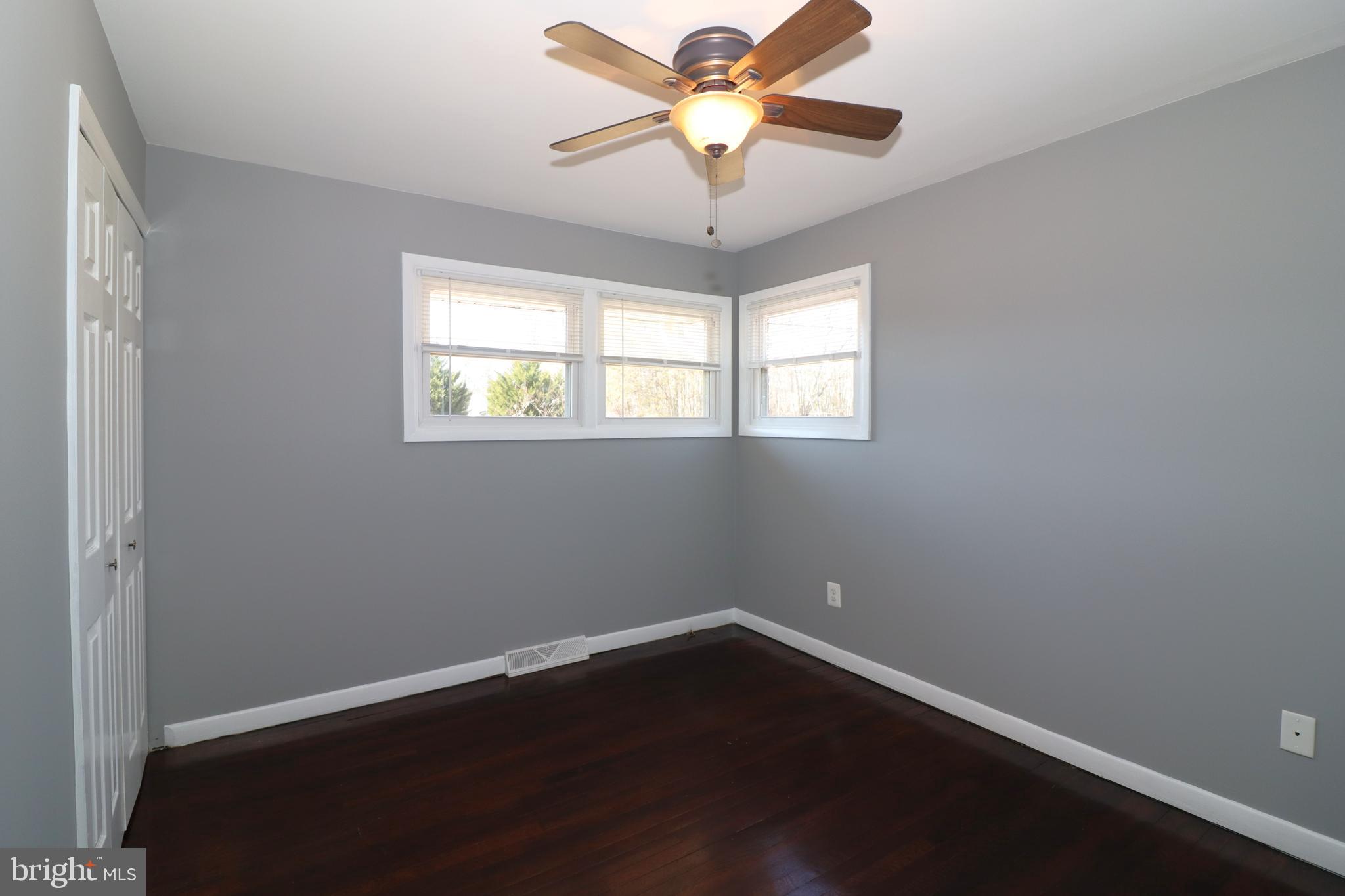 12551 Bristersburg Road Midland, VA 22728 - Photo 15 of 33 en empty room with wooden floor and windows