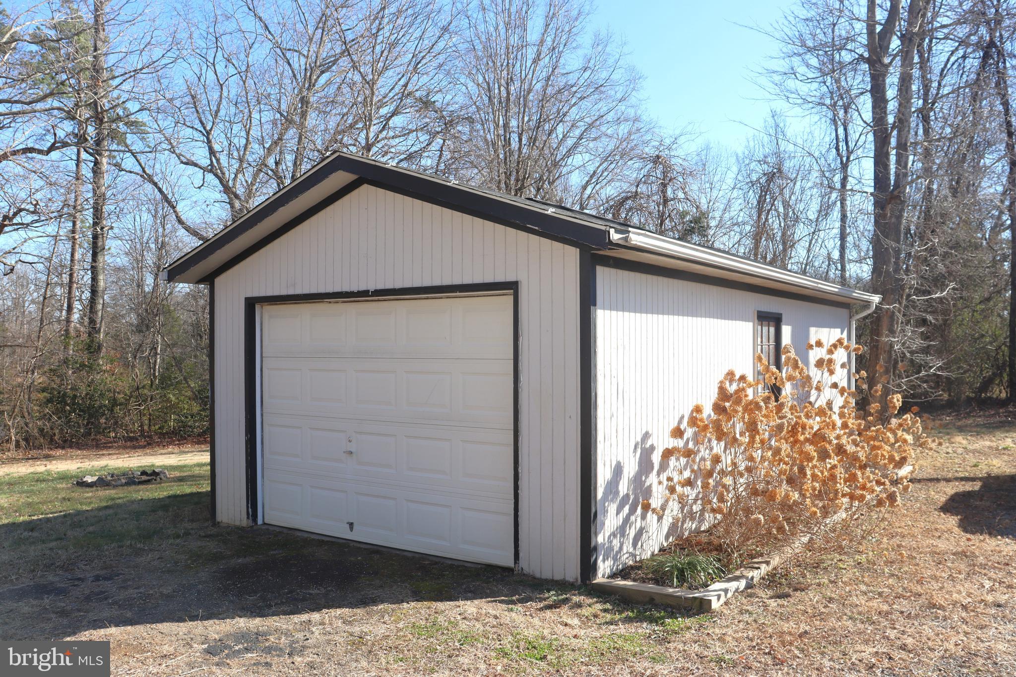 12551 Bristersburg Road Midland, VA 22728 - Photo 27 of 33 a wooden house with trees in front of it