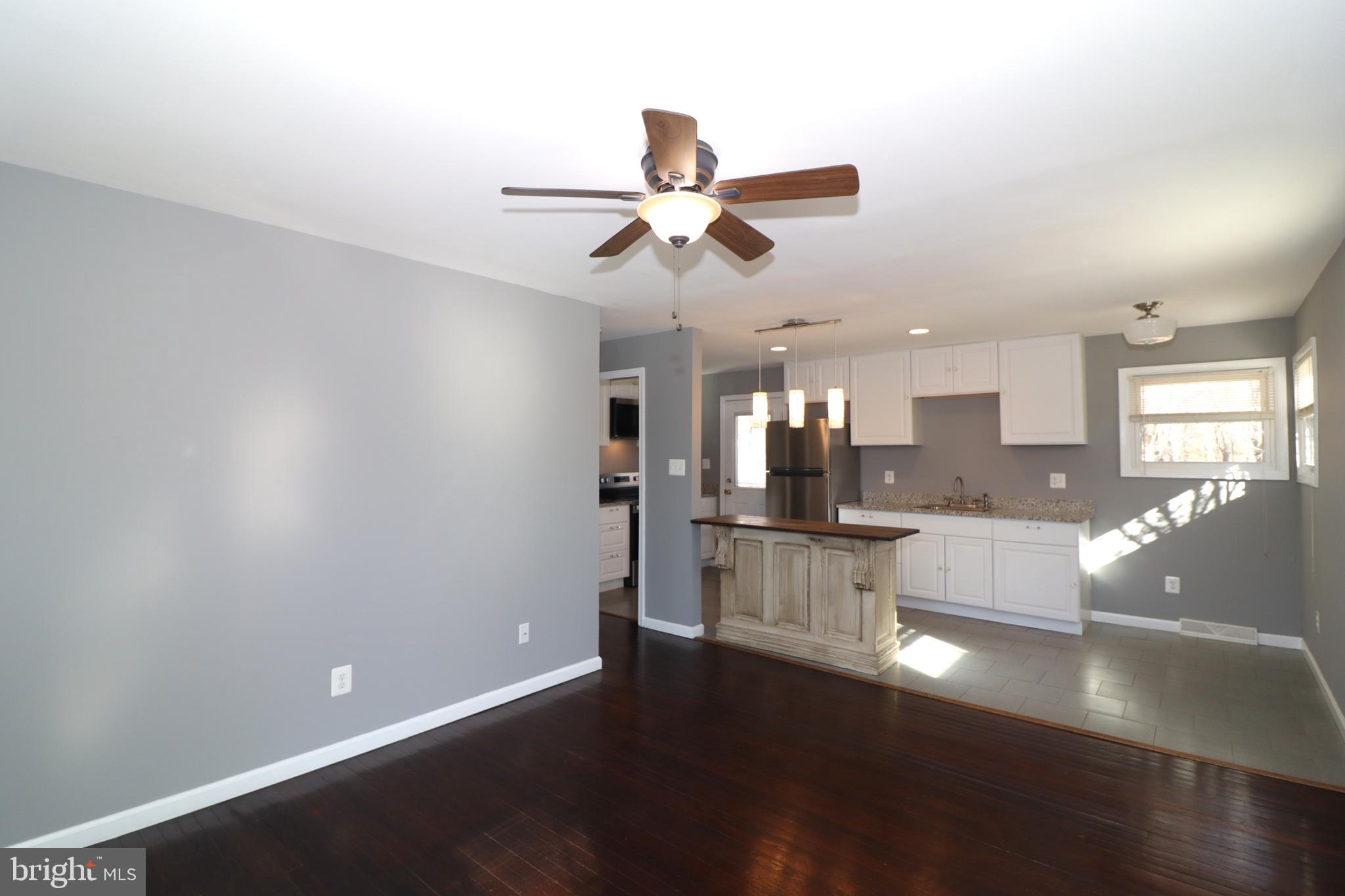 12551 Bristersburg Road Midland, VA 22728 - Photo 8 of 33 a view of a kitchen with wooden floor and a kitchen space