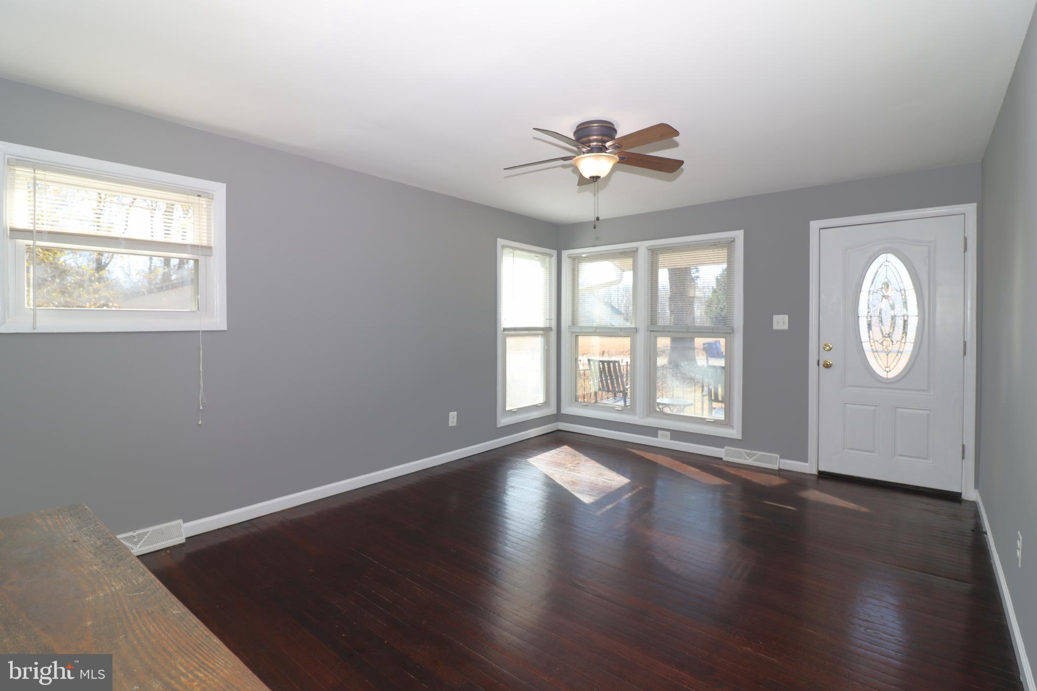 12551 Bristersburg Road Midland, VA 22728 - Photo 9 of 33 a view of an empty room with wooden floor and a window