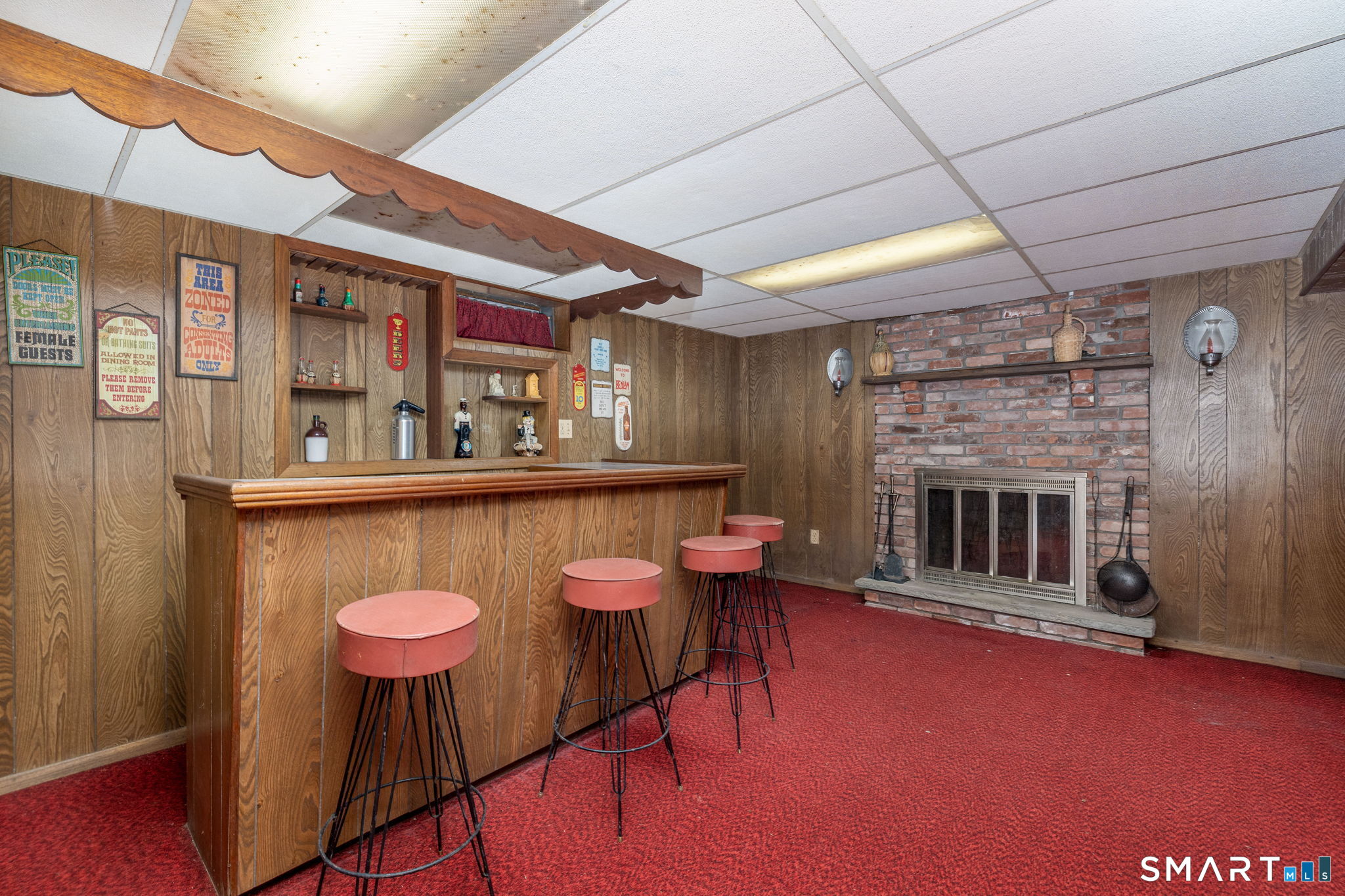 213 Brush Hill Road Litchfield, CT 06759 - Photo 19 of 27 FINISHED BASEMENT WITH FIREPLACE AND BAR