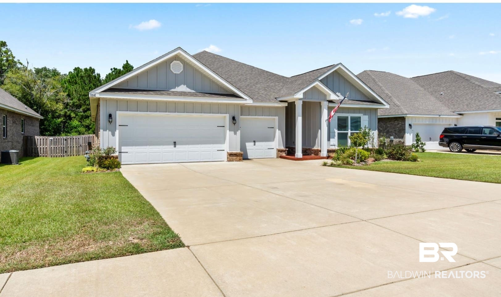 8841 Calverton Street Foley, AL 36535 - Photo 6 of 51 View of front of property with a garage and a front lawn