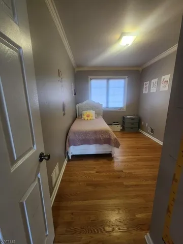 a bed room with a bed and a window