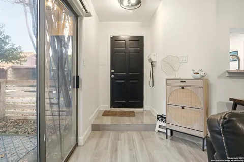 a view of a hallway with seating area