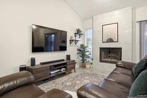 a living room with furniture and a flat screen tv