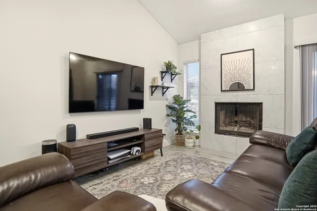 a living room with furniture and a flat screen tv