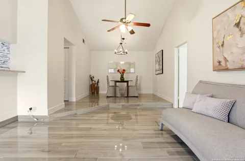a living room with furniture and white walls