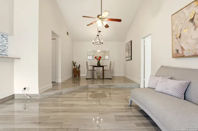 a living room with furniture and white walls