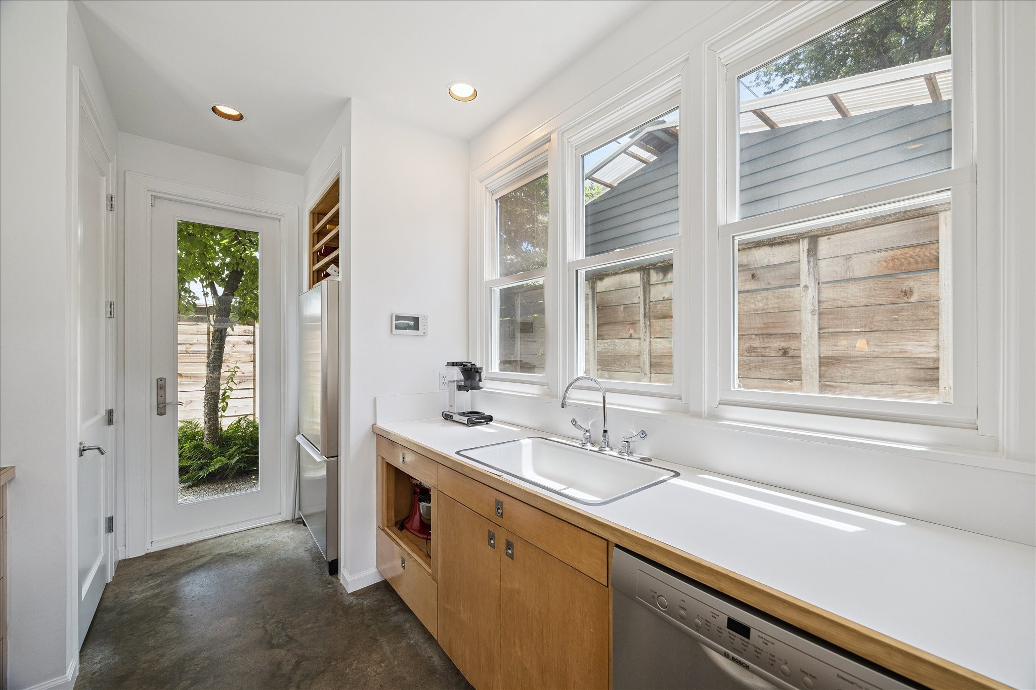 1418 Kipling Street Houston, TX 77006 - Photo 14 of 42 The glass door leads to a small private backyard space.
