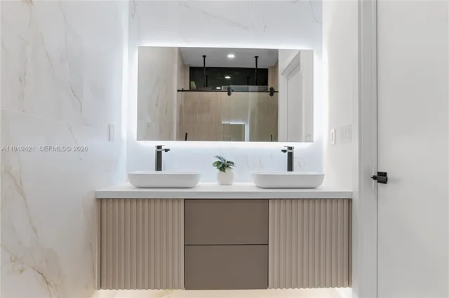 a bathroom with a shower and a sink