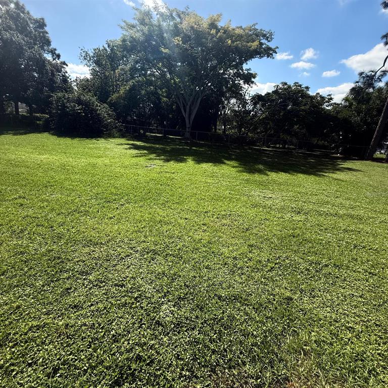1048 Newbern Street Northeast Palm Bay, FL 32905 - Photo 28 of 29 a view of outdoor space with deck and yard