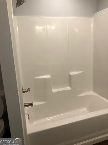 a bathroom with a bathtub