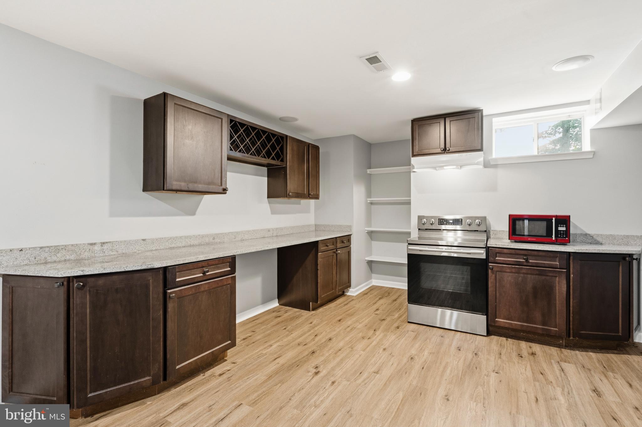 13305 Old Fort Road Fort Washington, MD 20744 - Photo 49 of 65 a kitchen with stainless steel appliances granite countertop a stove a sink and a microwave