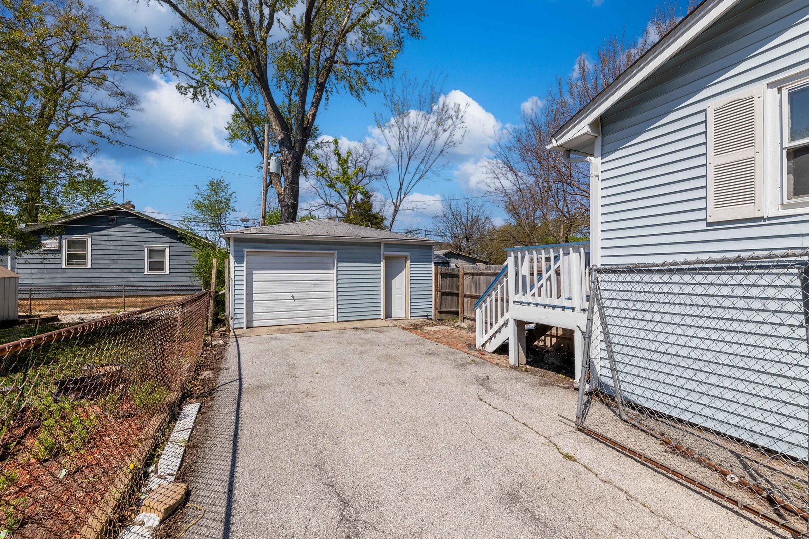 14536 Ridgeway Avenue Midlothian, IL 60445 - Photo 16 of 18 a view of a house with a patio