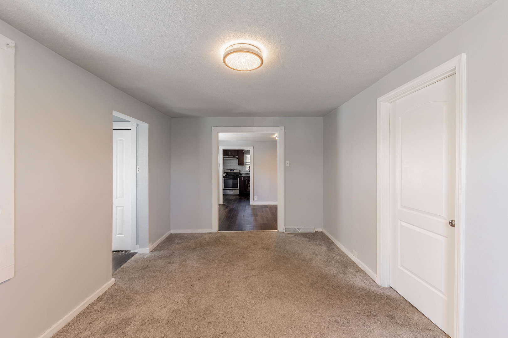 14536 Ridgeway Avenue Midlothian, IL 60445 - Photo 3 of 18 an empty room with closet and windows