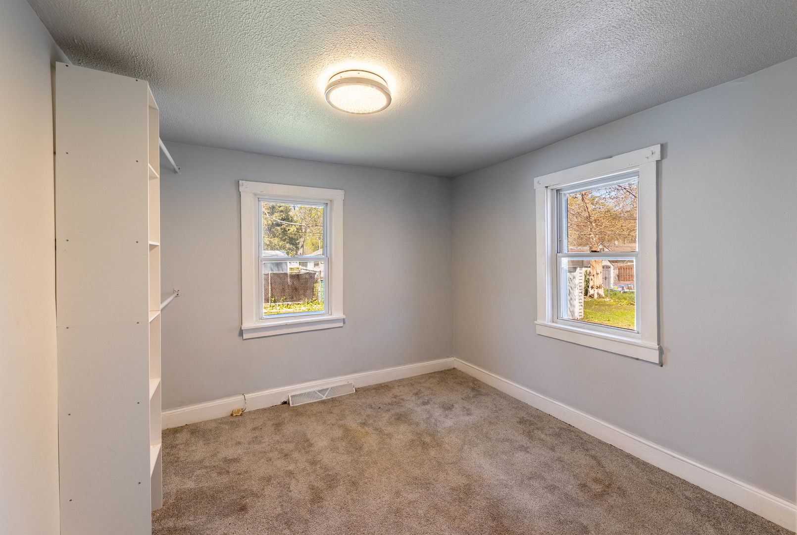 14536 Ridgeway Avenue Midlothian, IL 60445 - Photo 10 of 18 an empty room with windows