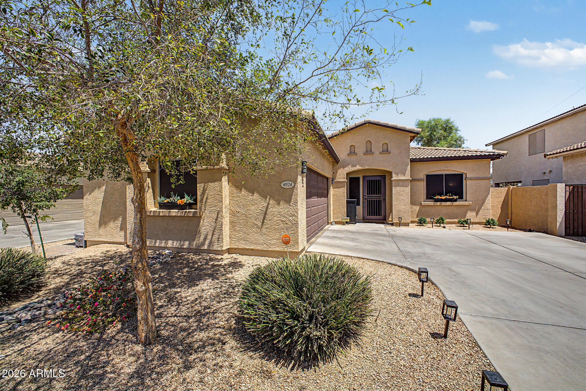 4924 West Harwell Road Laveen, AZ 85339 - Photo 1 of 27 a front view of a house with a yard