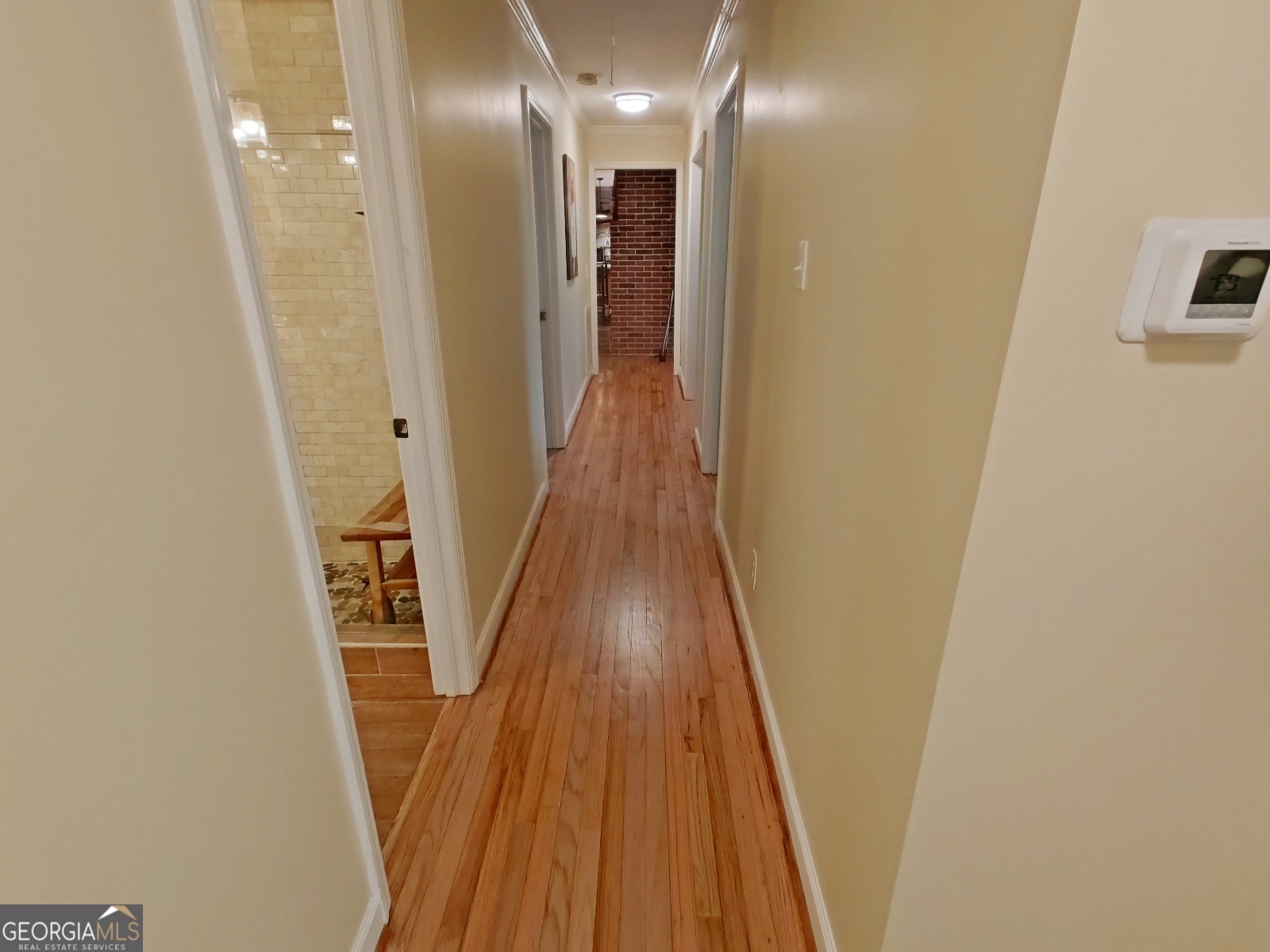 1491 Jack Malcolm Road Madison, GA 30650 - Photo 12 of 22 a view of a hallway with wooden floor