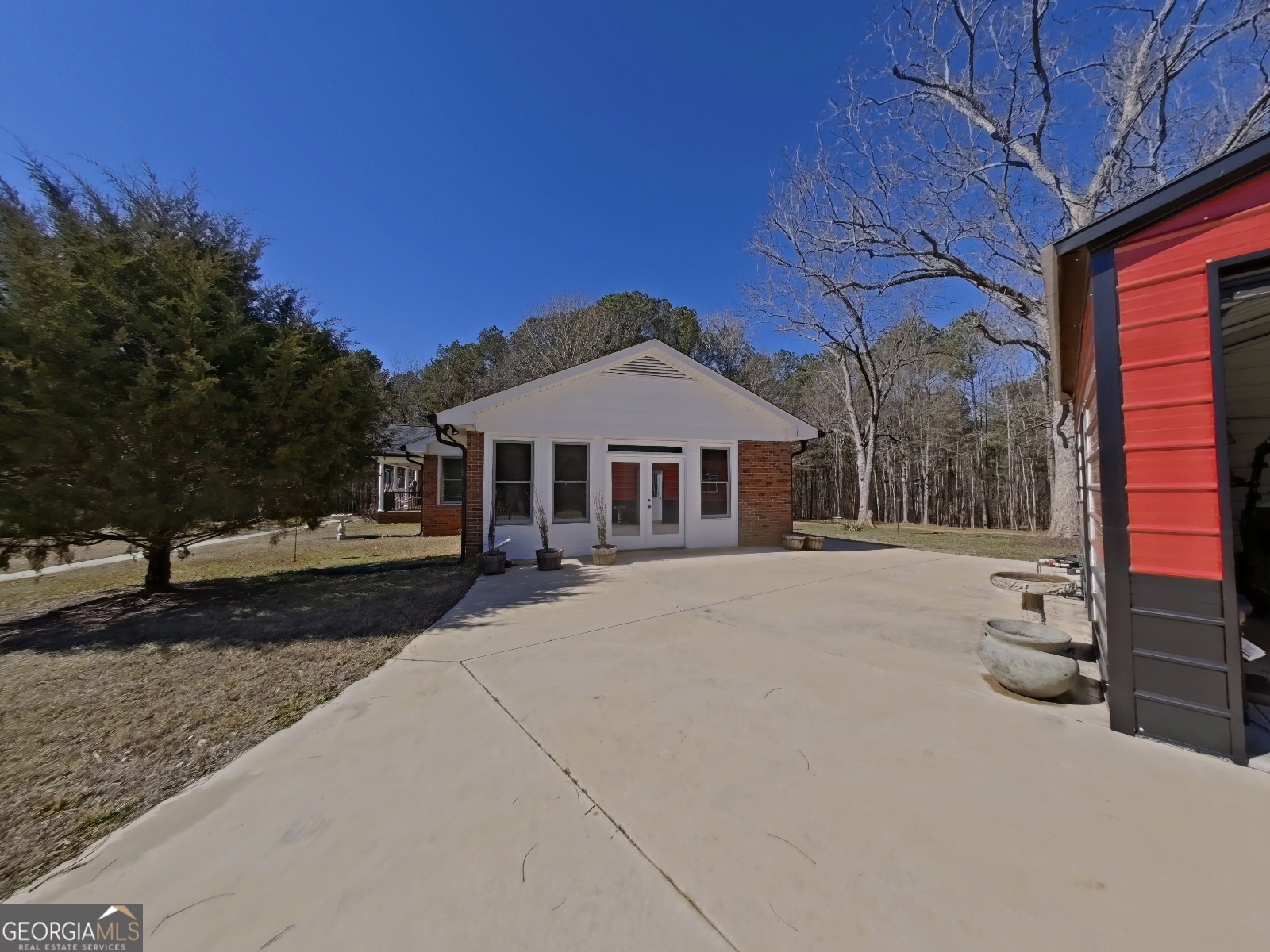 1491 Jack Malcolm Road Madison, GA 30650 - Photo 17 of 22 a front view of a house with yard and parking