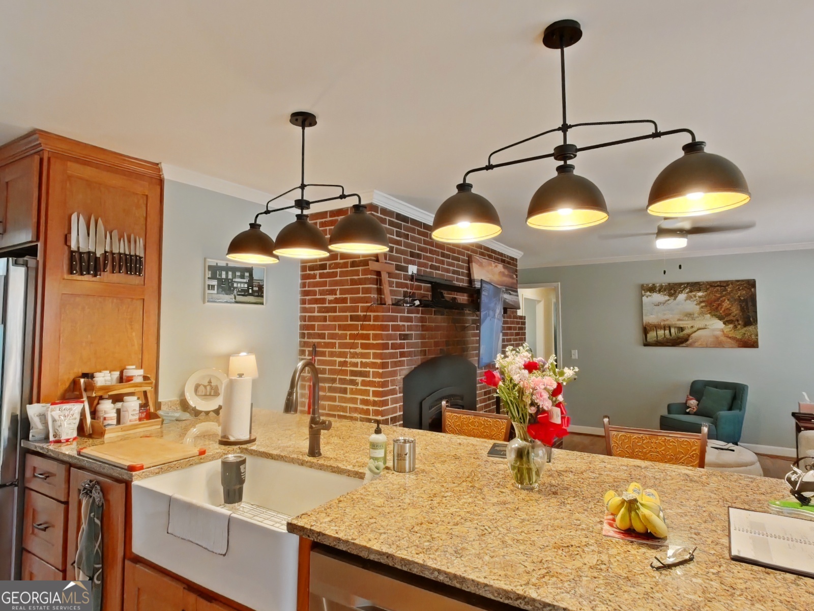 1491 Jack Malcolm Road Madison, GA 30650 - Photo 7 of 22 a kitchen with sink and chandelier