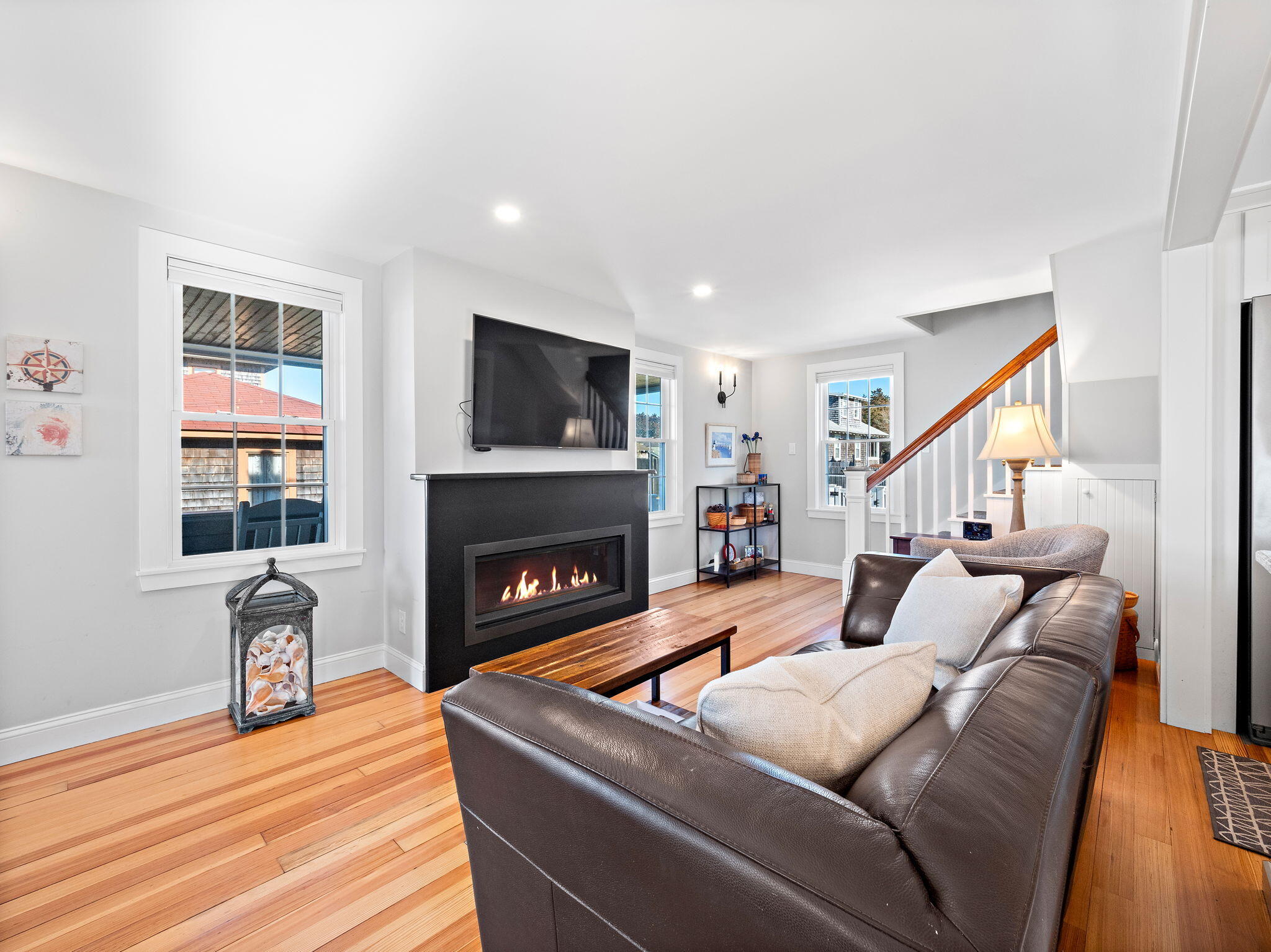 28 Spurr Road Pocasset, MA 02559 - Photo 16 of 47 a living room with furniture and a fireplace