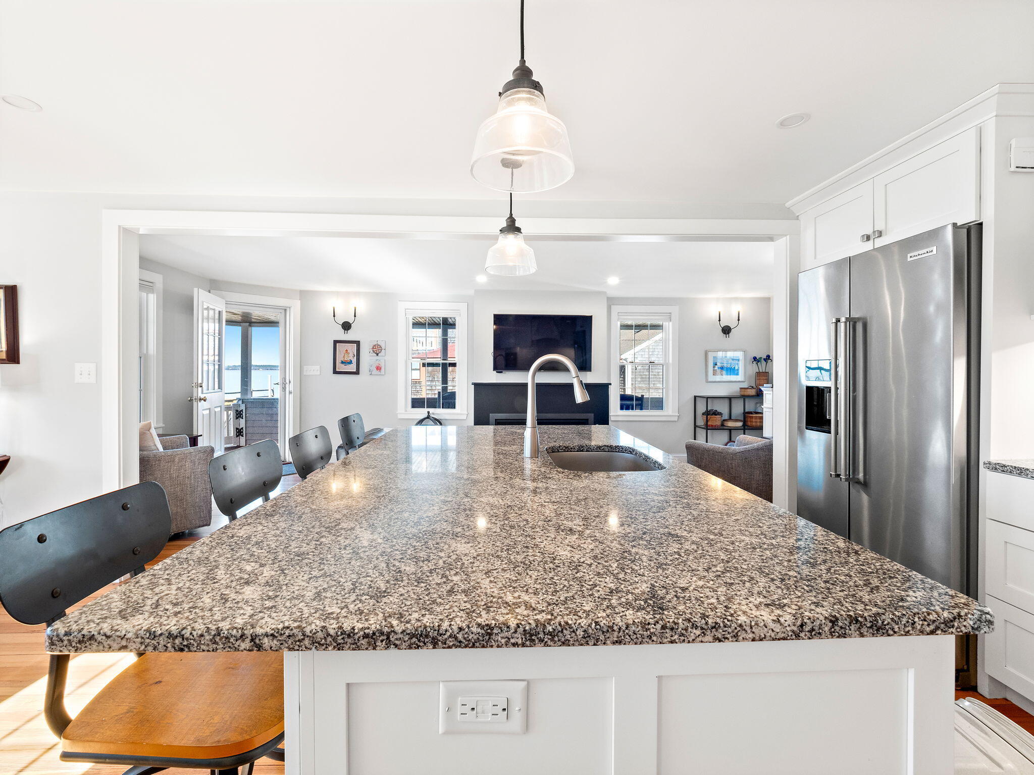 28 Spurr Road Pocasset, MA 02559 - Photo 20 of 47 a view of a kitchen with granite countertop living room and chandelier