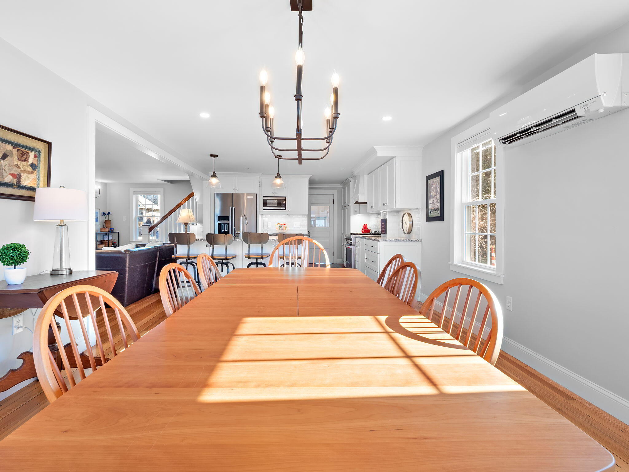 28 Spurr Road Pocasset, MA 02559 - Photo 23 of 47 a living room with lots of furniture a chandelier and a chandelier