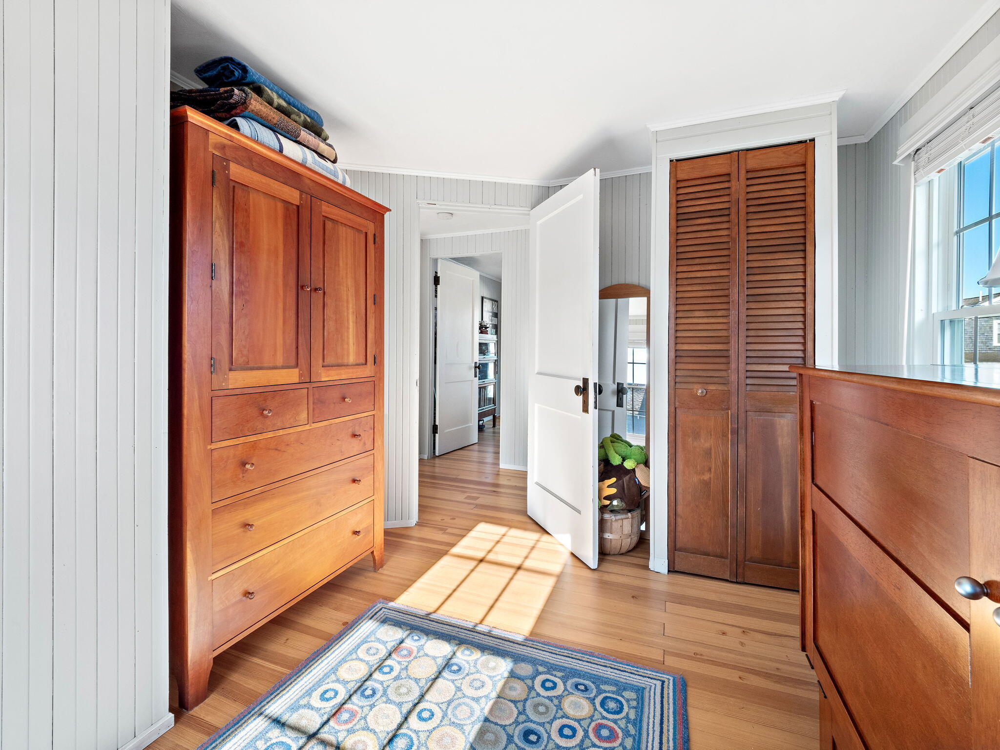 28 Spurr Road Pocasset, MA 02559 - Photo 31 of 47 a view of a hallway to rooms and wooden floor