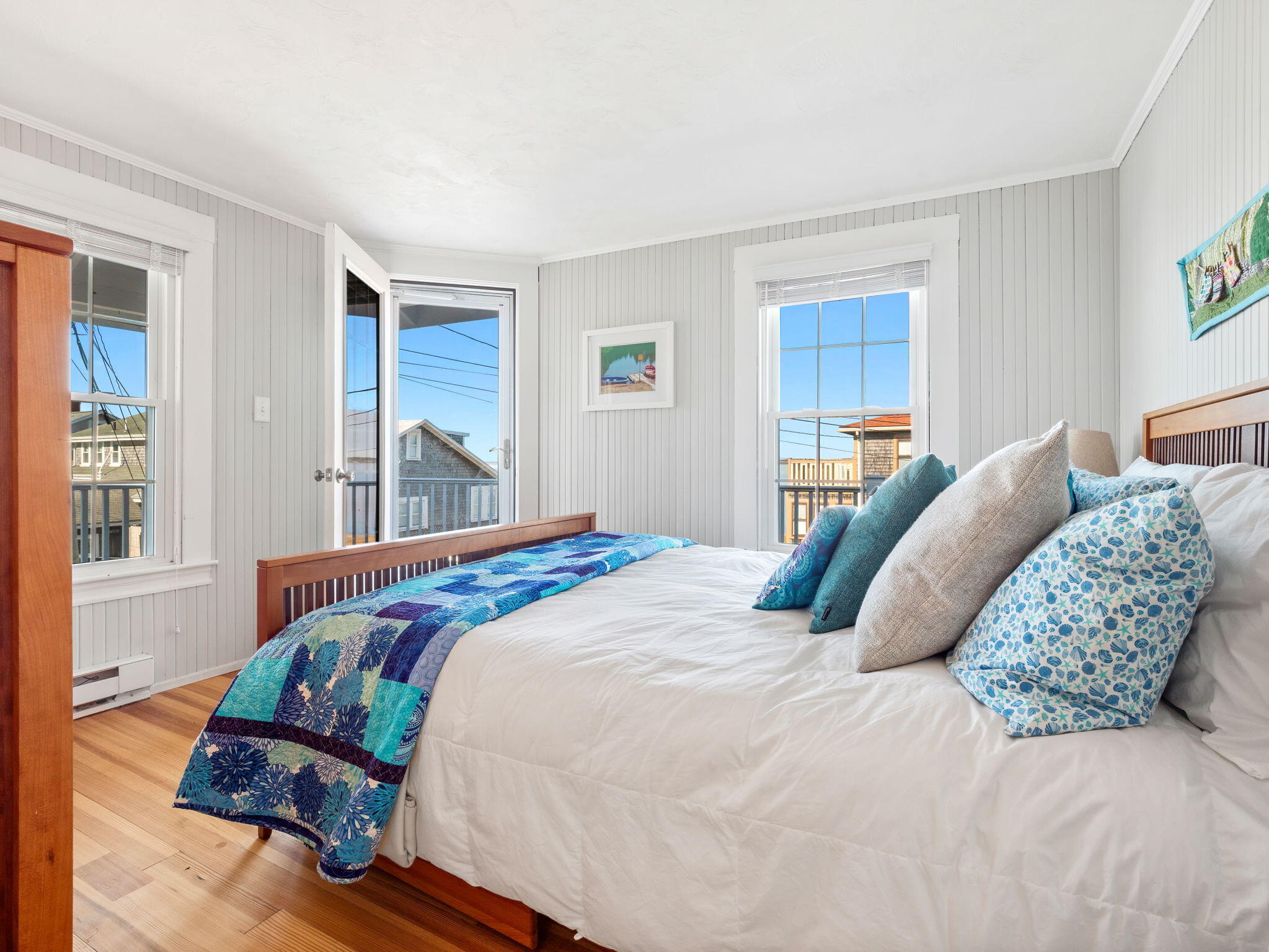 28 Spurr Road Pocasset, MA 02559 - Photo 33 of 47 a bedroom with a bed next to a window with kitchen view