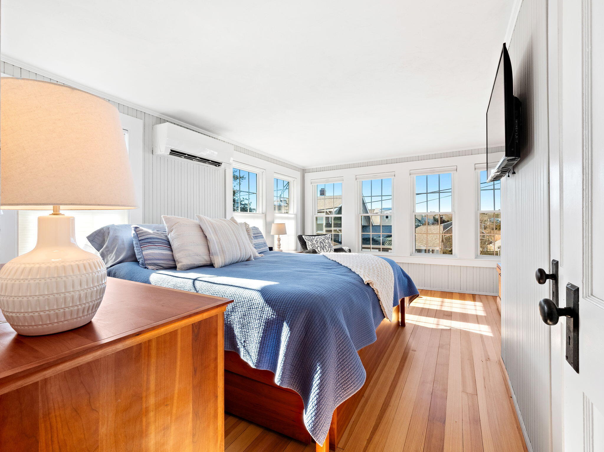 28 Spurr Road Pocasset, MA 02559 - Photo 36 of 47 a bedroom with a large bed and a flat tv screen on dresser