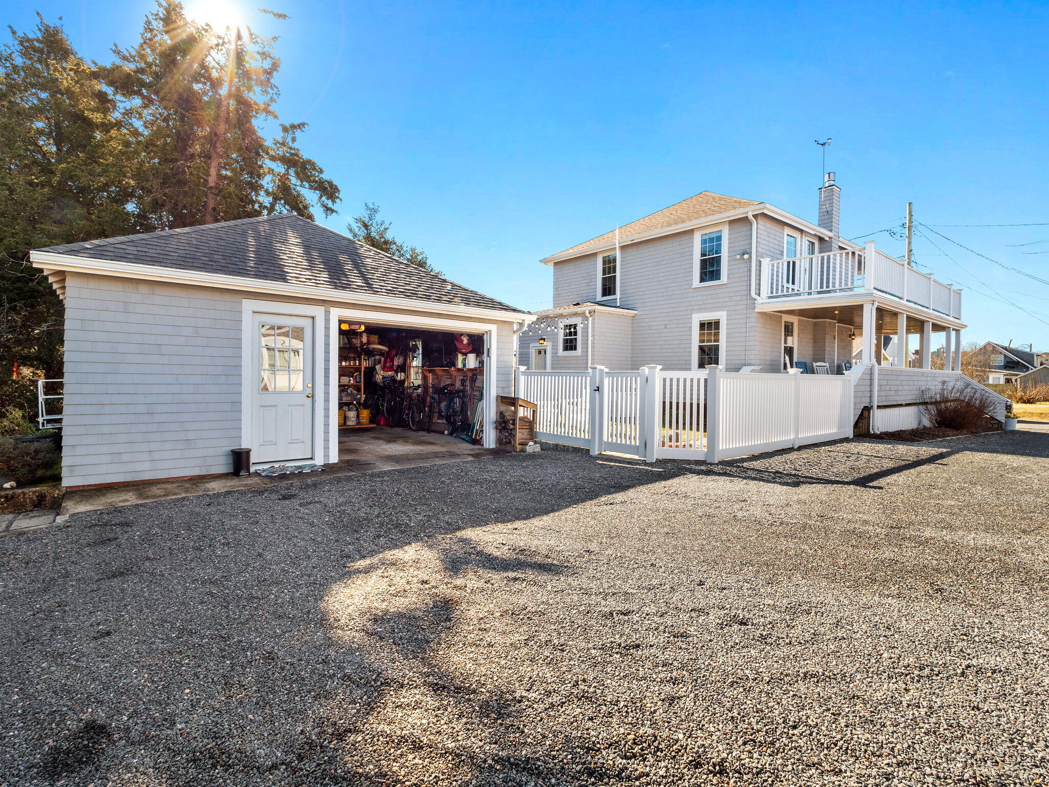 28 Spurr Road Pocasset, MA 02559 - Photo 7 of 47 a view of a white house with a yard and garage