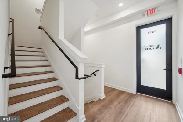 a view of entryway with wooden floor