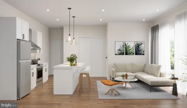 a living room with furniture a rug and a chandelier