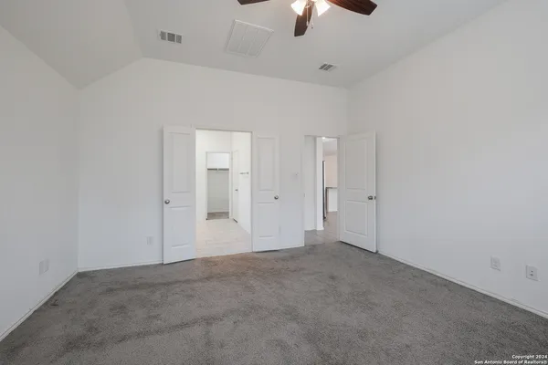 a bathroom with a shower sink and mirror