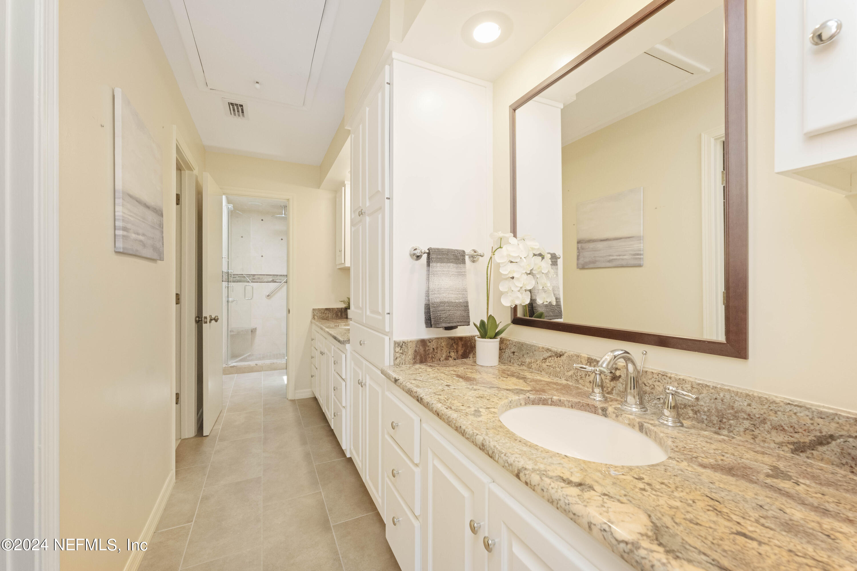 2279 Seminole Road, Unit 4 Atlantic Beach, FL 32233 - Photo 18 of 45 a bathroom with a double vanity sink and a mirror