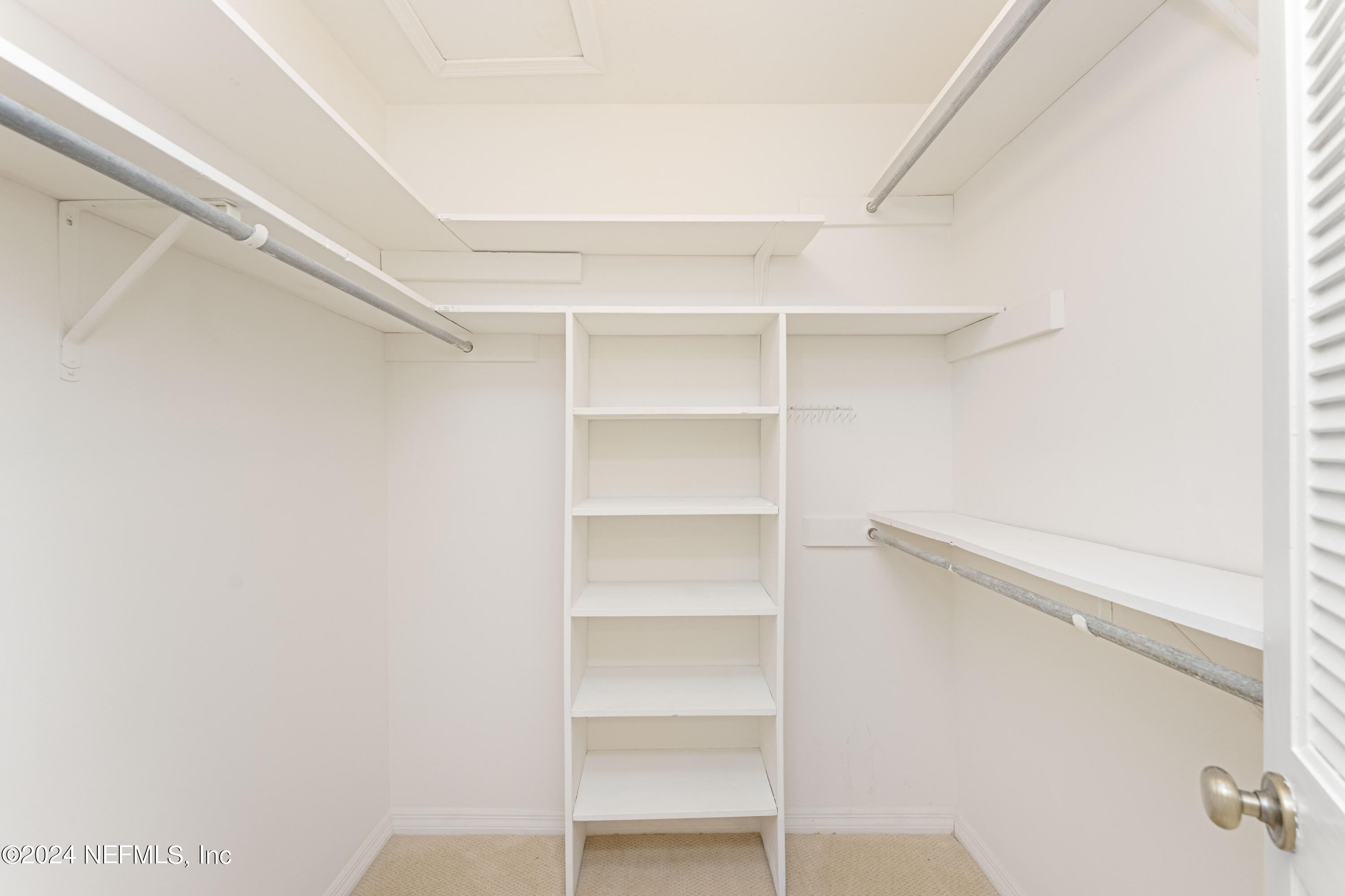 2279 Seminole Road, Unit 4 Atlantic Beach, FL 32233 - Photo 20 of 45 a view of walk in closet with empty racks