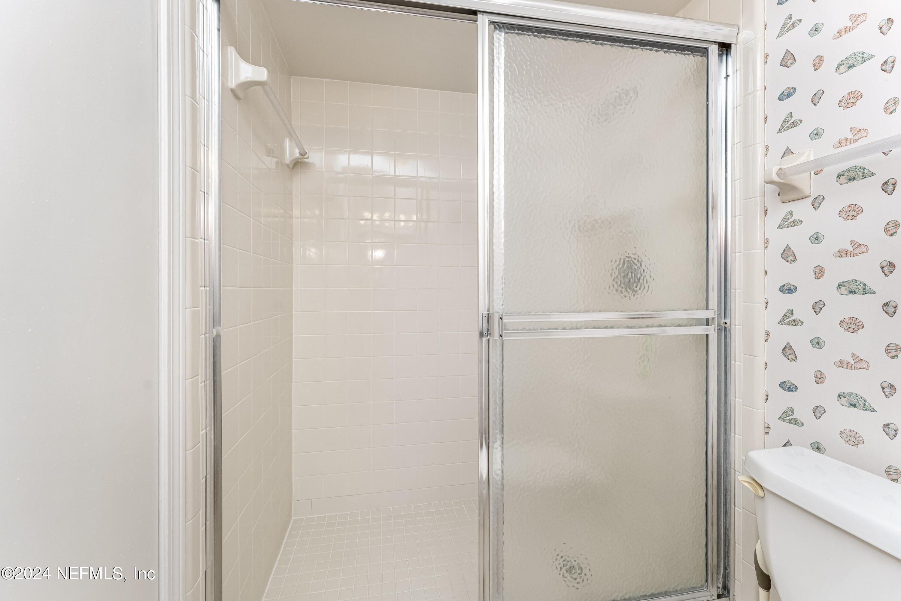 2279 Seminole Road, Unit 4 Atlantic Beach, FL 32233 - Photo 25 of 45 a bathroom with a bathtub and a shower