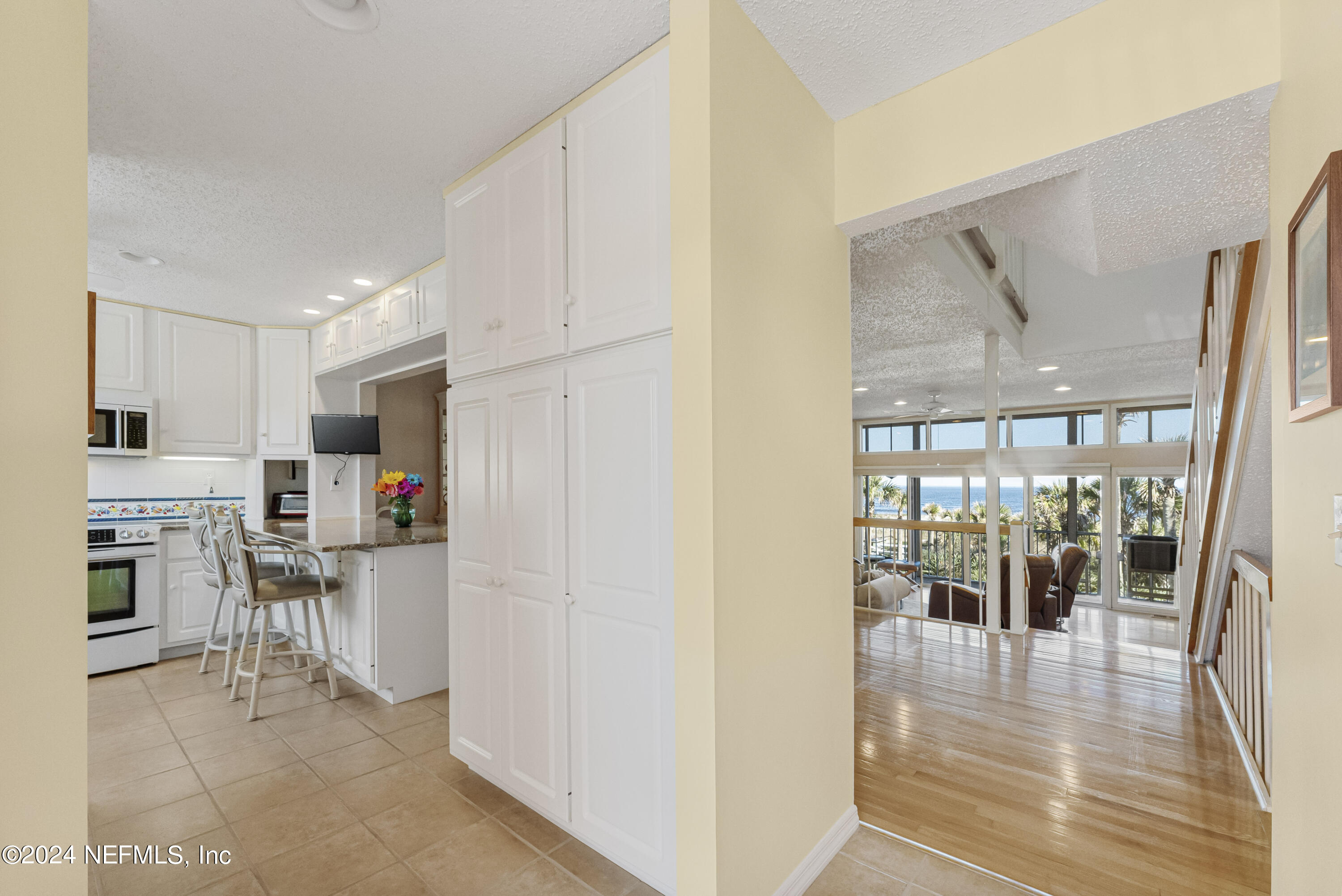 2279 Seminole Road, Unit 4 Atlantic Beach, FL 32233 - Photo 3 of 45 a view of a kitchen with furniture and wooden floor