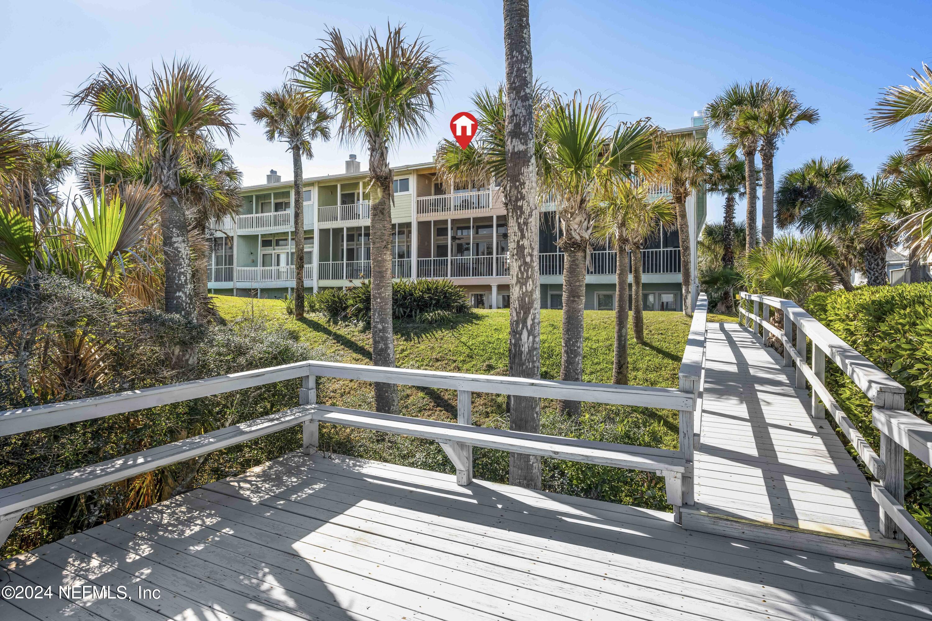 2279 Seminole Road, Unit 4 Atlantic Beach, FL 32233 - Photo 34 of 45 a view of a large building with a palm tree