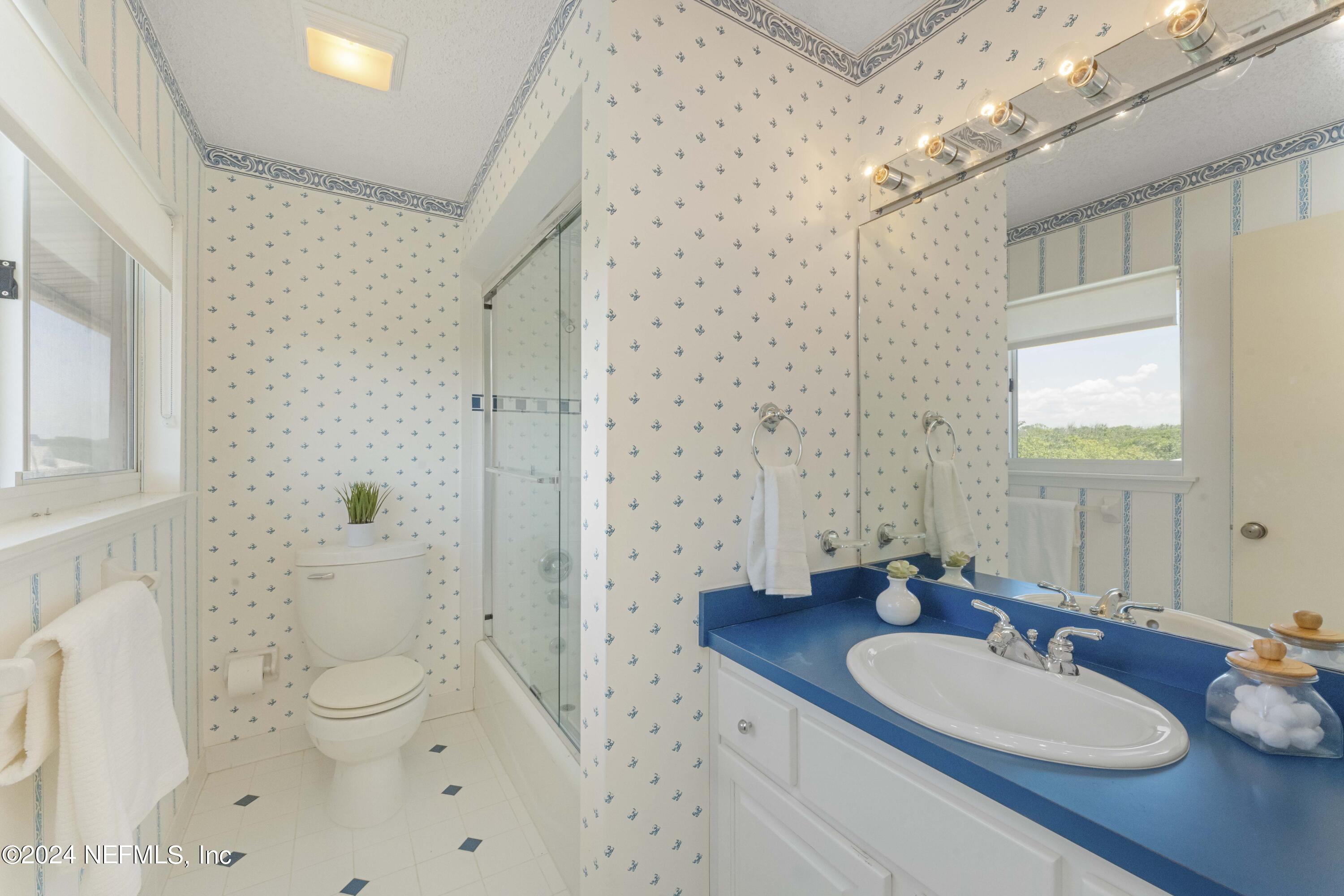2279 Seminole Road, Unit 4 Atlantic Beach, FL 32233 - Photo 45 of 45 a bathroom with a granite countertop sink a toilet and shower