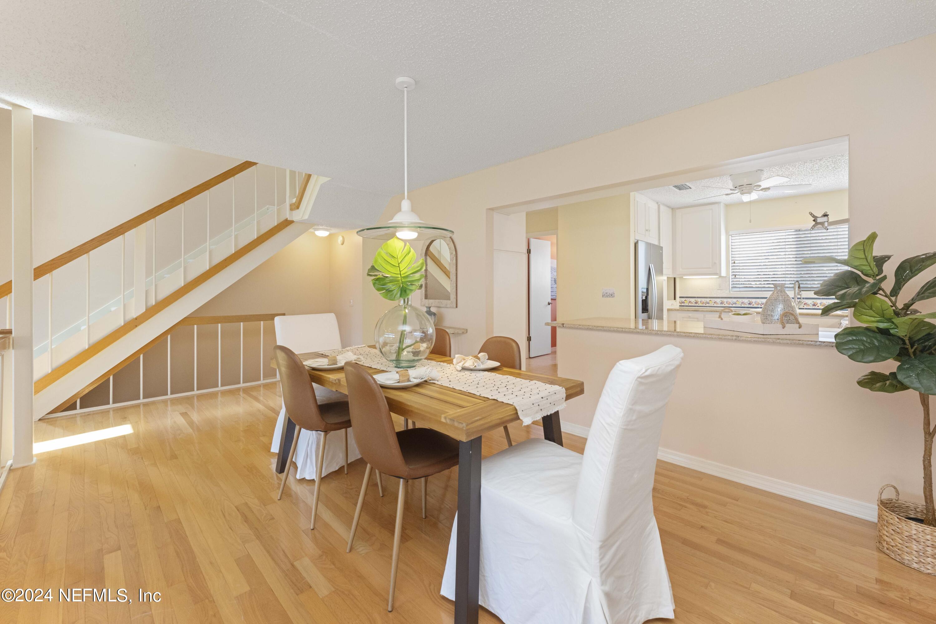 2279 Seminole Road, Unit 4 Atlantic Beach, FL 32233 - Photo 6 of 45 a view of a dining room with furniture and a potted plant