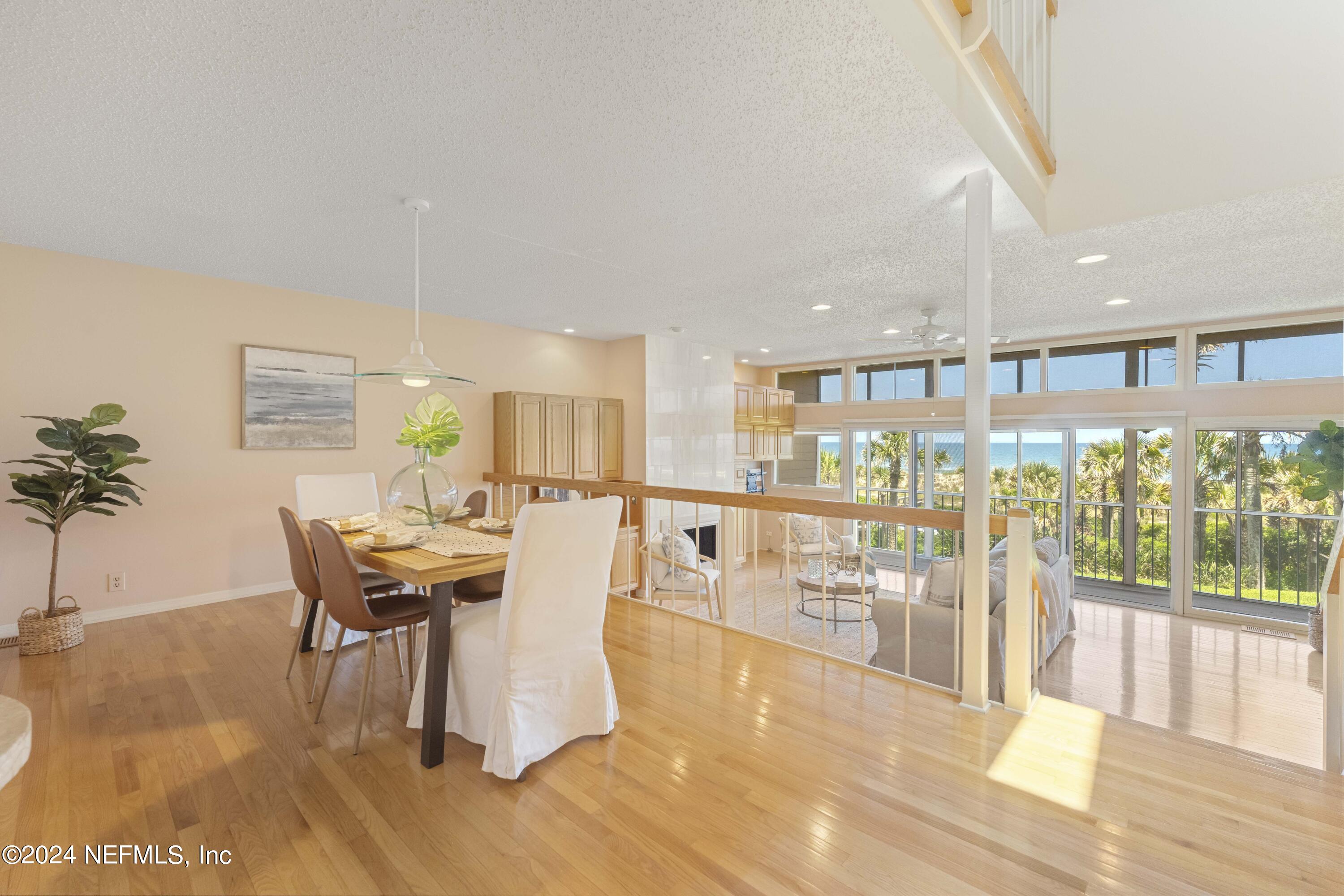 2279 Seminole Road, Unit 4 Atlantic Beach, FL 32233 - Photo 7 of 45 a dining room with furniture and wooden floor