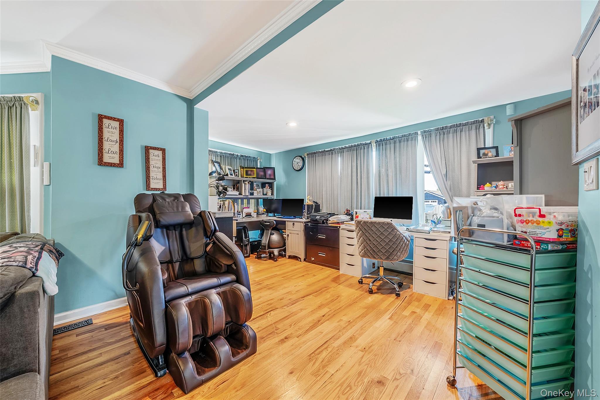 80 George Street Babylon, NY 11702 - Photo 19 of 41 a living room with furniture a window and gym equipment